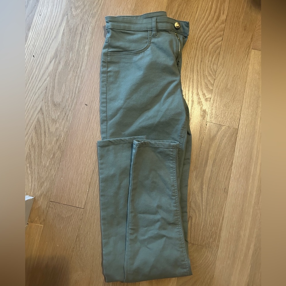 green tight jeans